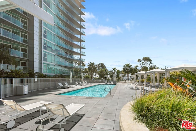 view of swimming pool with a patio area