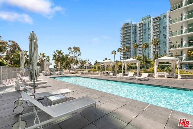 view of pool featuring a gazebo and a patio area