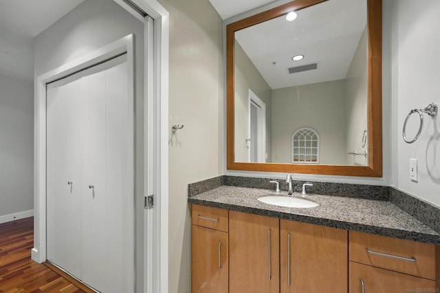 bathroom with wood-type flooring and vanity