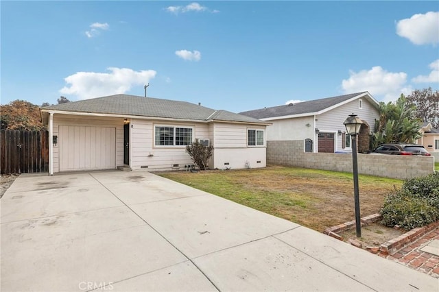 ranch-style home featuring a front lawn and a garage