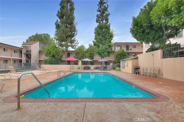 view of swimming pool featuring a patio