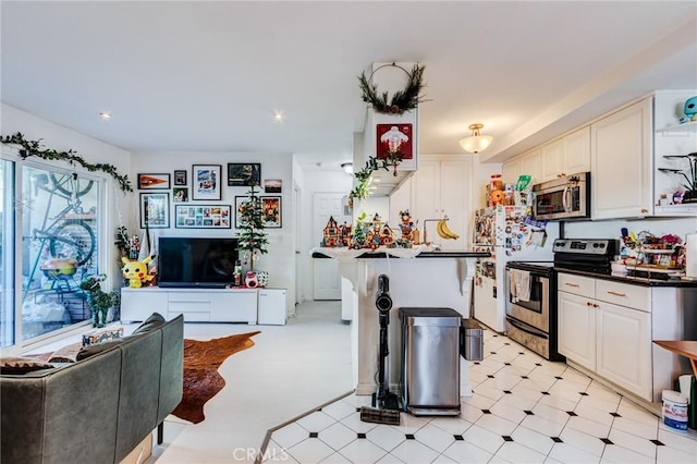 kitchen with appliances with stainless steel finishes and white cabinetry