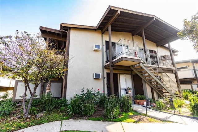 view of front of home with a balcony