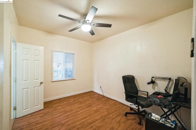 office space with ceiling fan and wood-type flooring