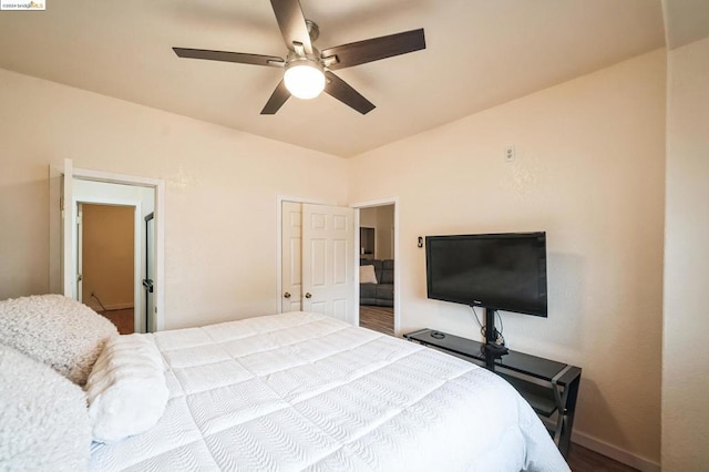 bedroom featuring ceiling fan and a closet