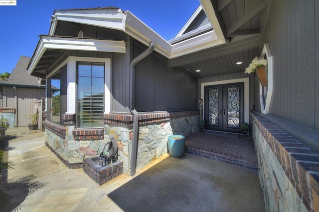 entrance to property featuring french doors