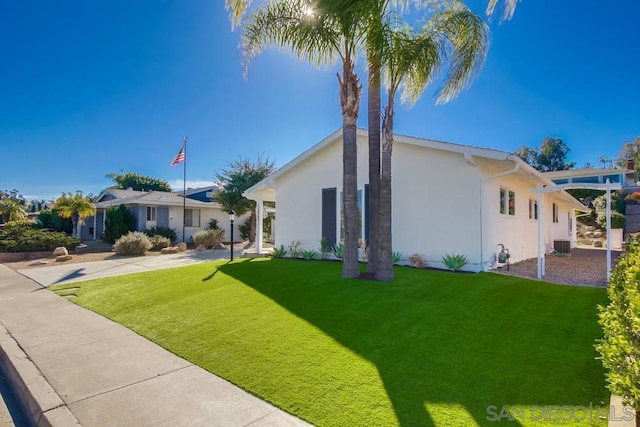 exterior space with a front yard and cooling unit