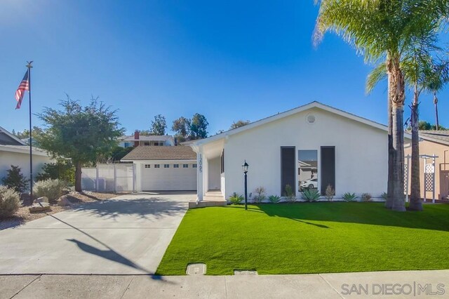 ranch-style house with a garage and a front lawn