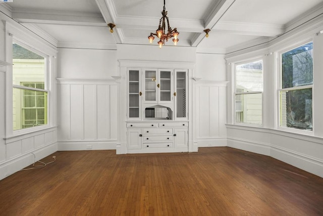 interior space featuring beam ceiling, a chandelier, and coffered ceiling