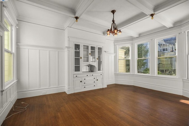 unfurnished sunroom featuring coffered ceiling, a notable chandelier, and beamed ceiling