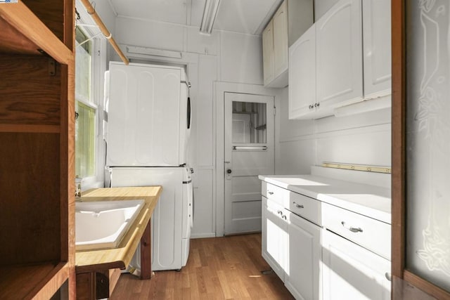 laundry area with sink and light wood-type flooring