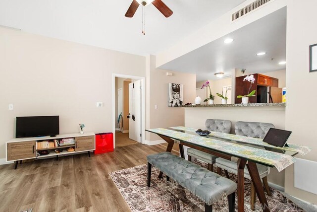 dining area featuring ceiling fan and wood-type flooring