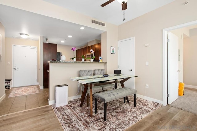 dining room featuring ceiling fan and light hardwood / wood-style floors