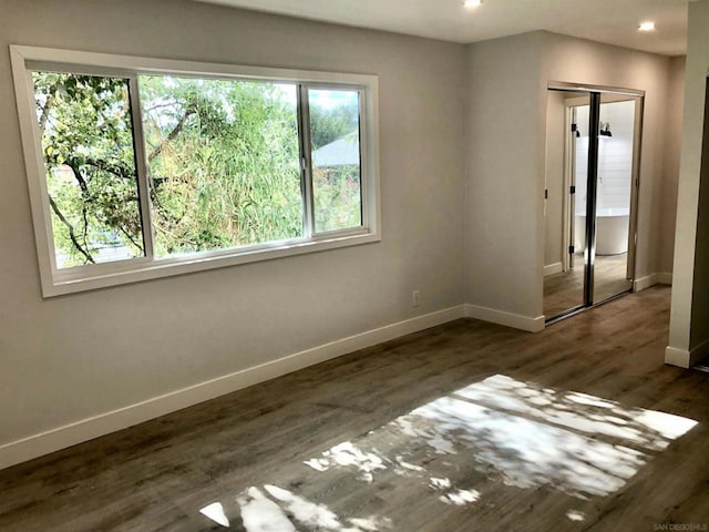 spare room featuring dark hardwood / wood-style flooring