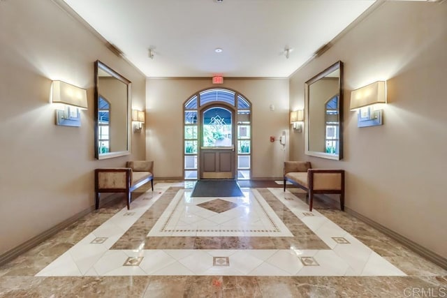 entrance foyer featuring ornamental molding