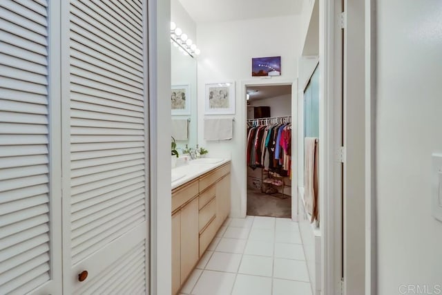 bathroom with tile patterned flooring and vanity