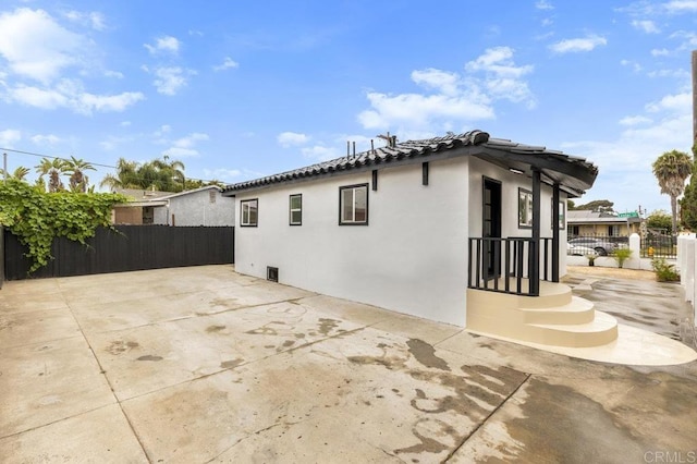 view of property exterior featuring a patio