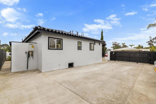 view of home's exterior with a patio area