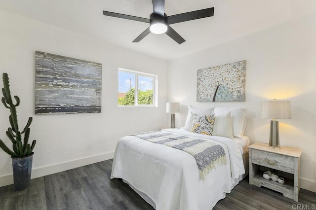 bedroom with ceiling fan and dark hardwood / wood-style floors