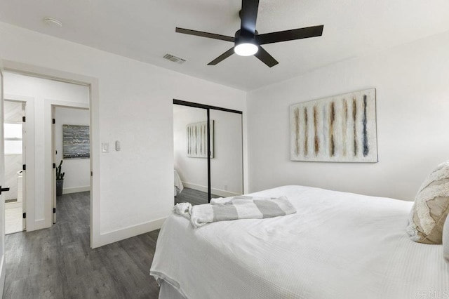 bedroom featuring a closet, dark hardwood / wood-style flooring, and ceiling fan