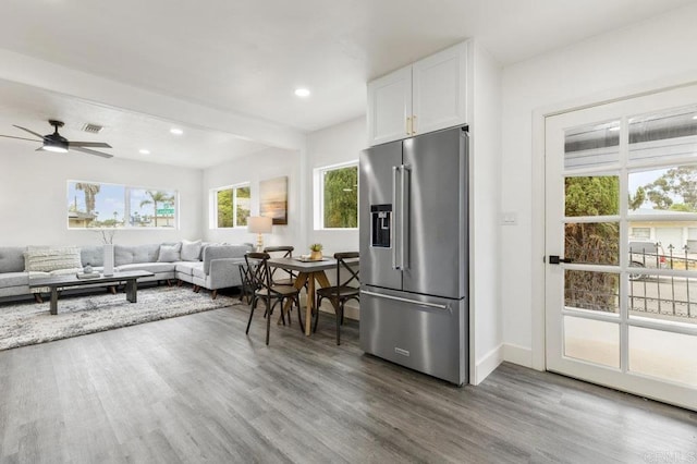 kitchen with ceiling fan, white cabinetry, hardwood / wood-style flooring, and high end fridge