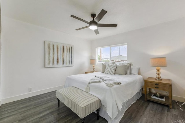 bedroom with ceiling fan and dark wood-type flooring