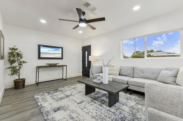 living room with ceiling fan and hardwood / wood-style floors