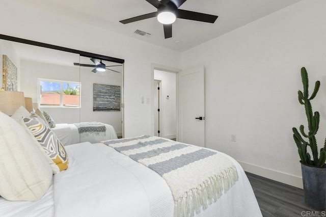 bedroom featuring dark wood-type flooring and ceiling fan