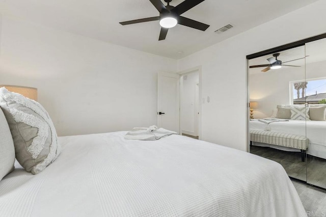 bedroom featuring ceiling fan and a closet