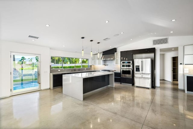 kitchen featuring a center island, decorative backsplash, hanging light fixtures, appliances with stainless steel finishes, and wall chimney exhaust hood