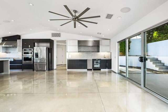 unfurnished living room featuring ceiling fan, lofted ceiling, and wine cooler