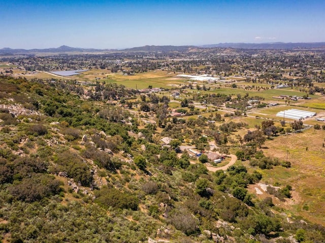 birds eye view of property featuring a mountain view