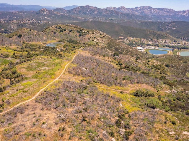 bird's eye view with a water and mountain view