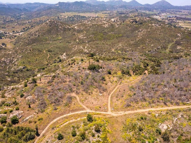 drone / aerial view featuring a mountain view