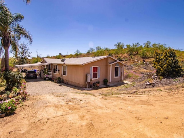 ranch-style house with a carport