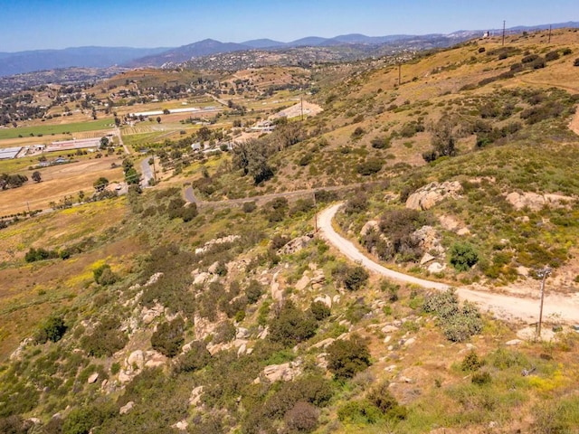 birds eye view of property with a rural view and a mountain view