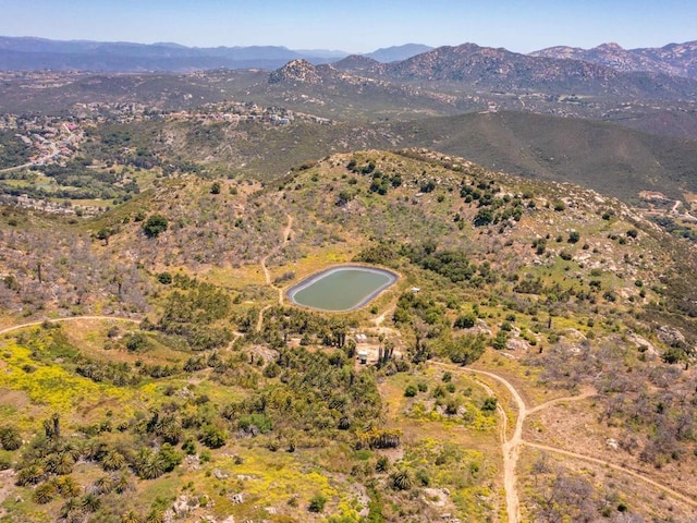 birds eye view of property with a mountain view