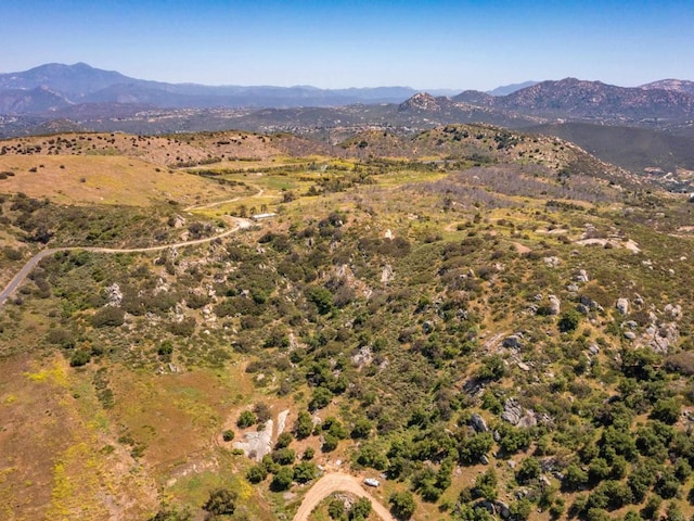 drone / aerial view featuring a mountain view