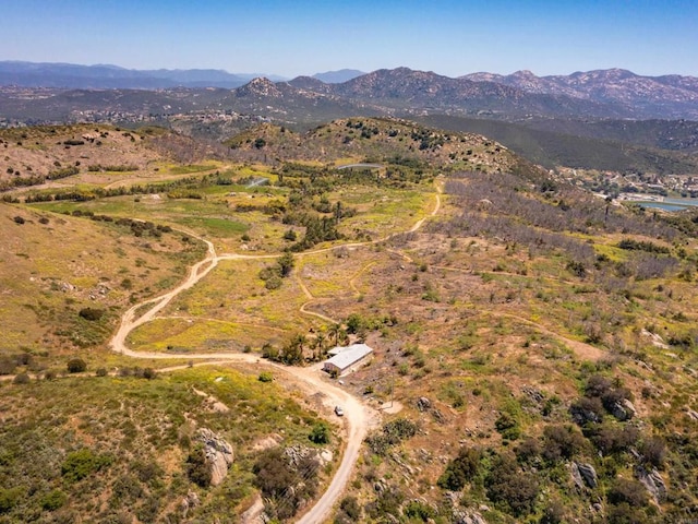 birds eye view of property featuring a mountain view