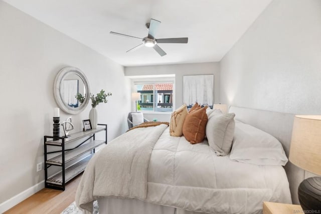 bedroom featuring ceiling fan and light wood-type flooring