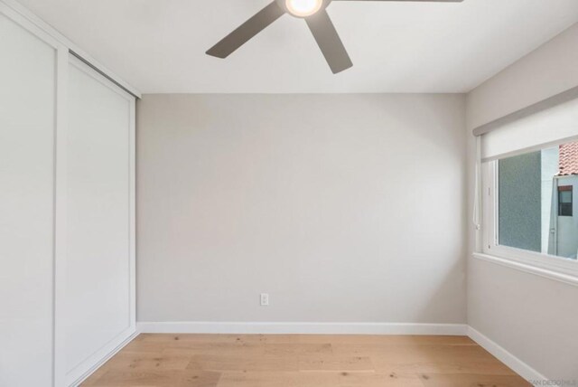 interior space with ceiling fan, a closet, and light wood-type flooring