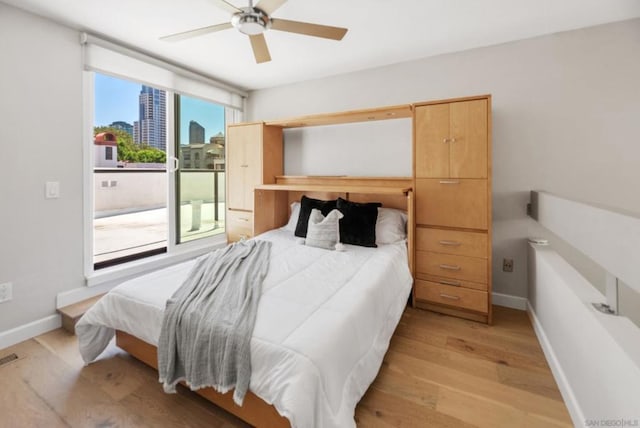 bedroom featuring ceiling fan and light hardwood / wood-style floors