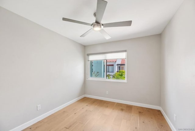 spare room featuring ceiling fan and light wood-type flooring