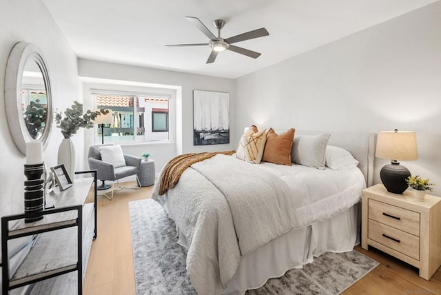 bedroom featuring ceiling fan and light hardwood / wood-style floors