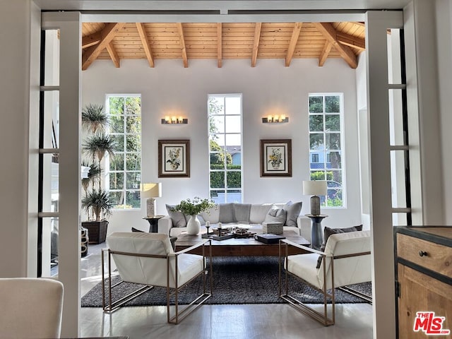 living room featuring hardwood / wood-style floors, wooden ceiling, and beam ceiling