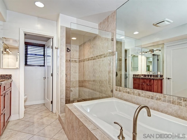 full bathroom with toilet, independent shower and bath, tile patterned flooring, and vanity