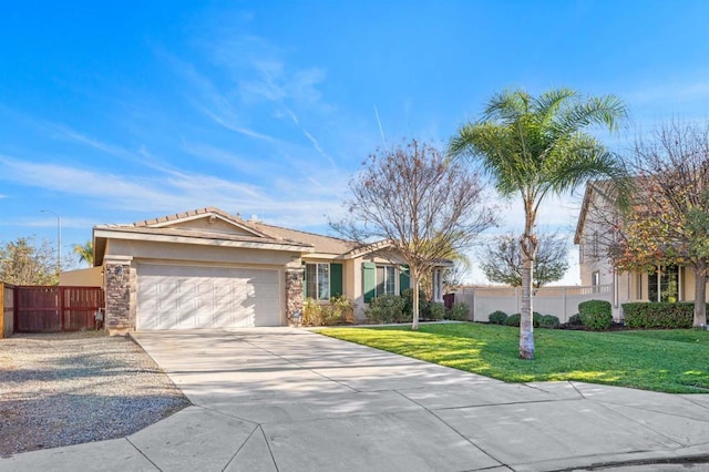 ranch-style house featuring a garage and a front lawn