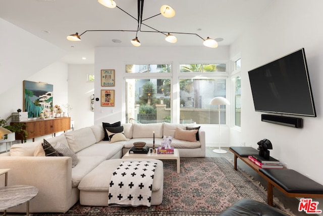 living room with an inviting chandelier