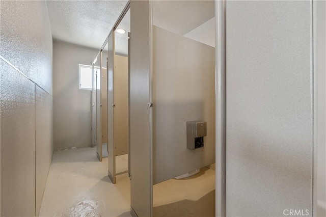 bathroom featuring concrete floors and a textured ceiling