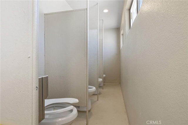 bathroom featuring toilet and a bidet